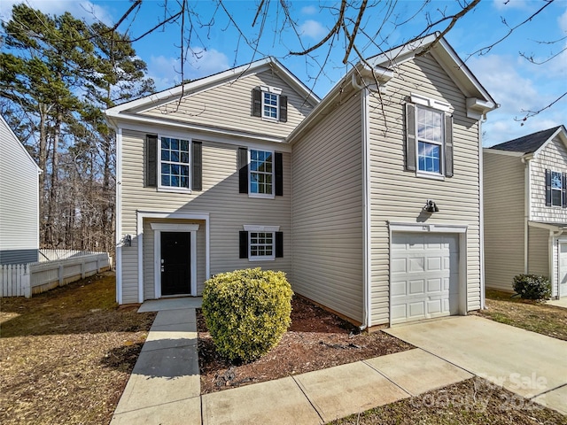 traditional-style home with an attached garage and driveway