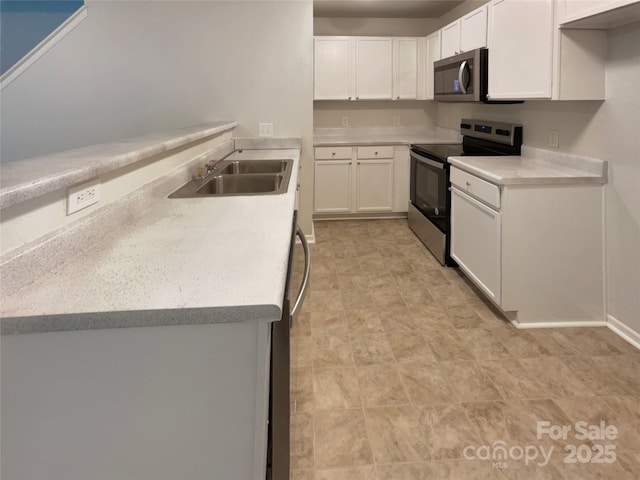 1121 Swearngan Ridge Ct, Charlotte, NC 28216 - kitchen featuring stainless steel appliances, white cabinetry, and light countertops