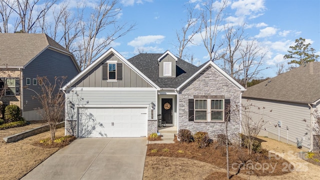 craftsman inspired home with driveway, stone siding, a shingled roof, and board and batten siding