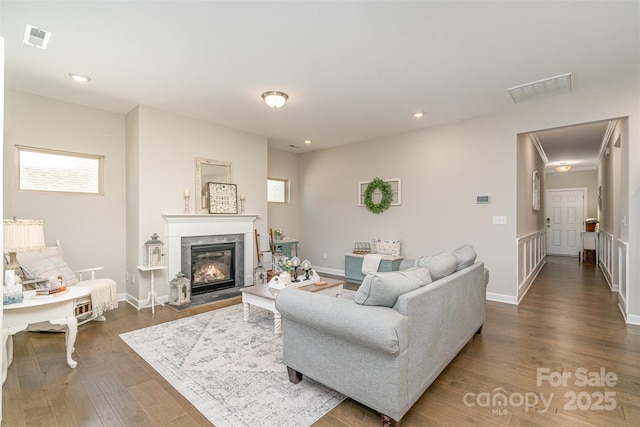 14707 Batteliere Dr, Charlotte, NC 28278 - living room with a premium fireplace, wood finished floors, visible vents, and recessed lighting