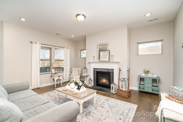 14707 Batteliere Dr, Charlotte, NC 28278 - living room with baseboards, visible vents, dark wood finished floors, and a fireplace with flush hearth