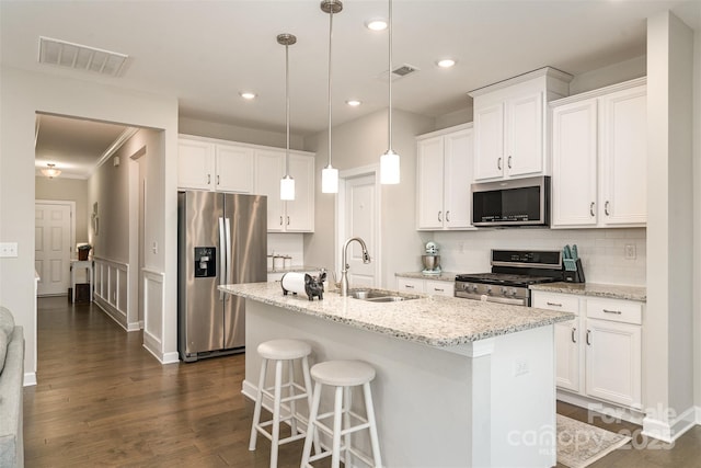 14707 Batteliere Dr, Charlotte, NC 28278 - kitchen featuring white cabinets, visible vents, stainless steel appliances, and a sink