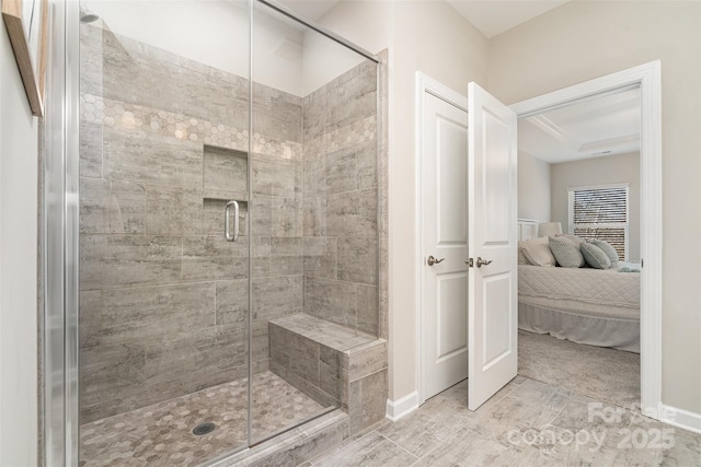 14707 Batteliere Dr, Charlotte, NC 28278 - ensuite bathroom featuring a stall shower, ensuite bath, and baseboards