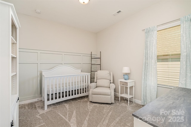 14707 Batteliere Dr, Charlotte, NC 28278 - bedroom with light carpet, a decorative wall, and visible vents