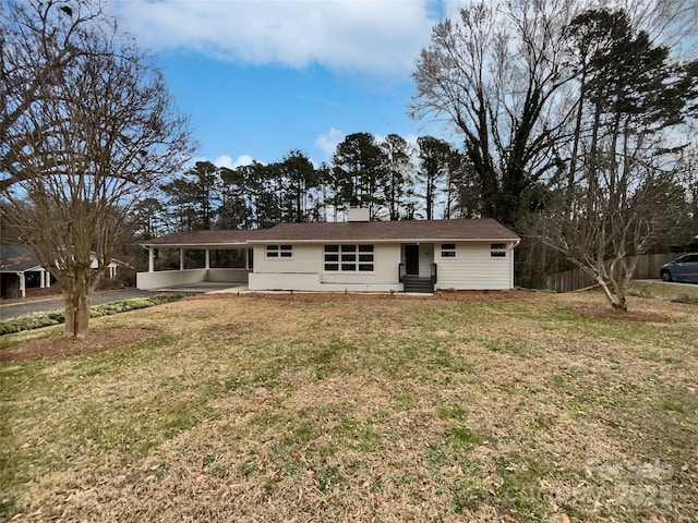 view of front of home featuring entry steps and a front yard