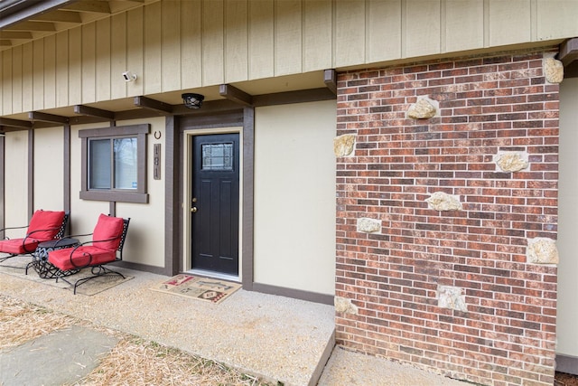 entrance to property with brick siding