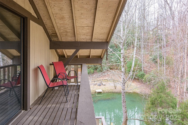 wooden deck featuring a water view