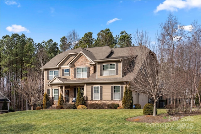 craftsman house featuring a garage, stone siding, covered porch, and a front lawn