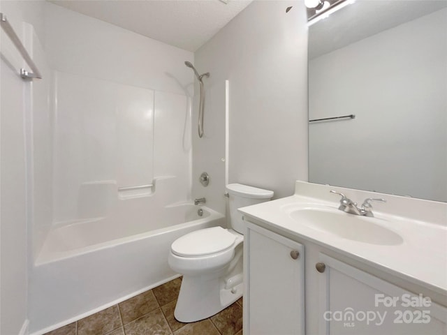 bathroom with  shower combination, tile patterned flooring, vanity, and toilet