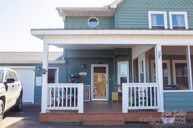 view of exterior entry with a garage