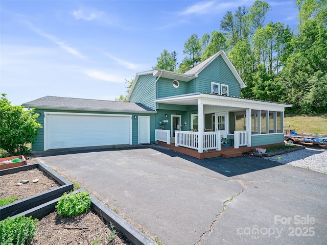 48 Meadowlark Ln, Spruce Pine, NC 28777 - view of front of property with covered porch, driveway, and an attached garage