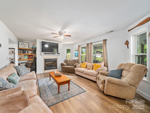 48 Meadowlark Ln, Spruce Pine, NC 28777 - living area with ceiling fan, light wood-style floors, and a tiled fireplace