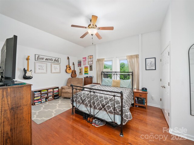 48 Meadowlark Ln, Spruce Pine, NC 28777 - bedroom with wood finished floors, ceiling fan, and vaulted ceiling