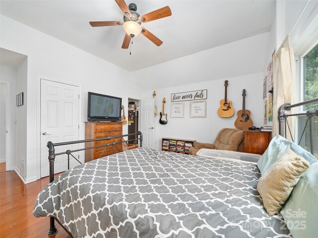 48 Meadowlark Ln, Spruce Pine, NC 28777 - bedroom featuring wood finished floors, vaulted ceiling, baseboards, and ceiling fan