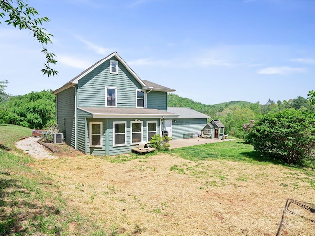 48 Meadowlark Ln, Spruce Pine, NC 28777 - back of house featuring a patio area and a lawn