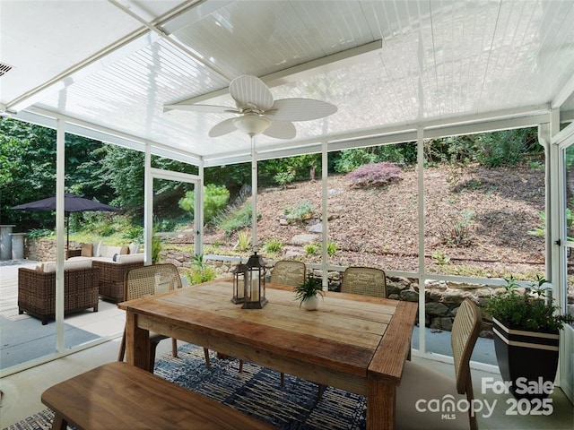 sunroom / solarium with ceiling fan