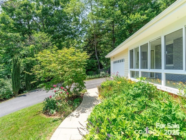 view of yard featuring a garage