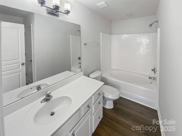 bathroom featuring vanity, shower / bathtub combination, and wood finished floors