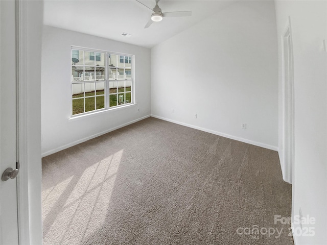 unfurnished room with carpet, visible vents, ceiling fan, and baseboards