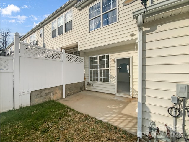 exterior space featuring a patio area and fence