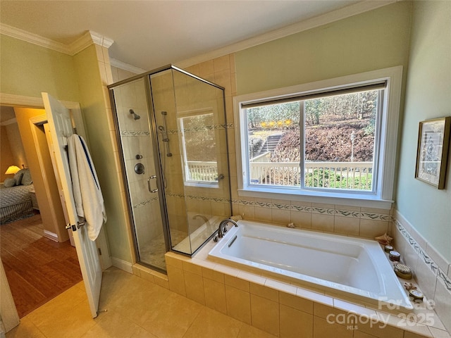 full bath featuring a shower stall, ornamental molding, and a bath