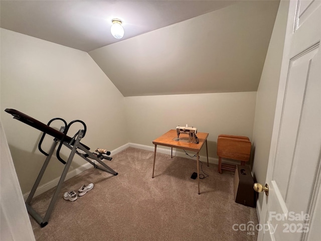 exercise area with lofted ceiling, carpet flooring, and baseboards