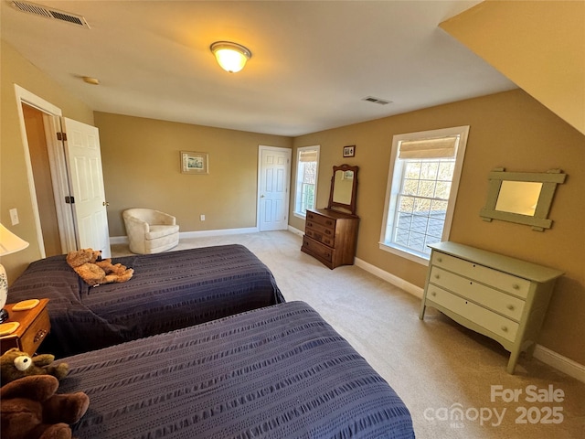 bedroom with light carpet, baseboards, and visible vents