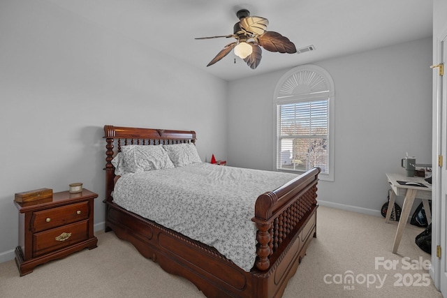 bedroom featuring light carpet, visible vents, baseboards, and a ceiling fan