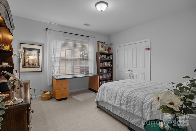 bedroom featuring light colored carpet, visible vents, and baseboards