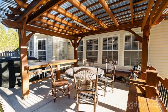 view of patio with outdoor dining area and a pergola