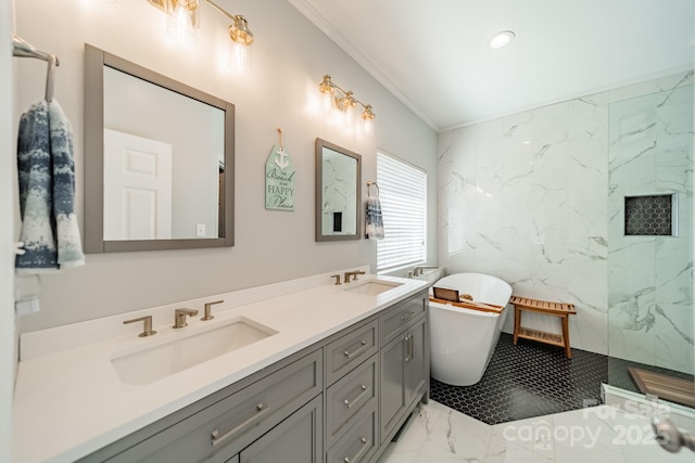 bathroom with a sink, a freestanding bath, marble finish floor, and ornamental molding