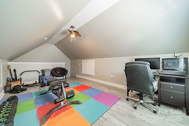 office featuring vaulted ceiling, ceiling fan, baseboards, and wood finished floors