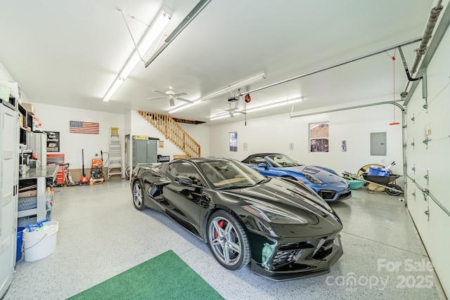 garage featuring electric panel and a ceiling fan