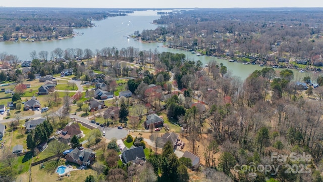 aerial view with a residential view and a water view