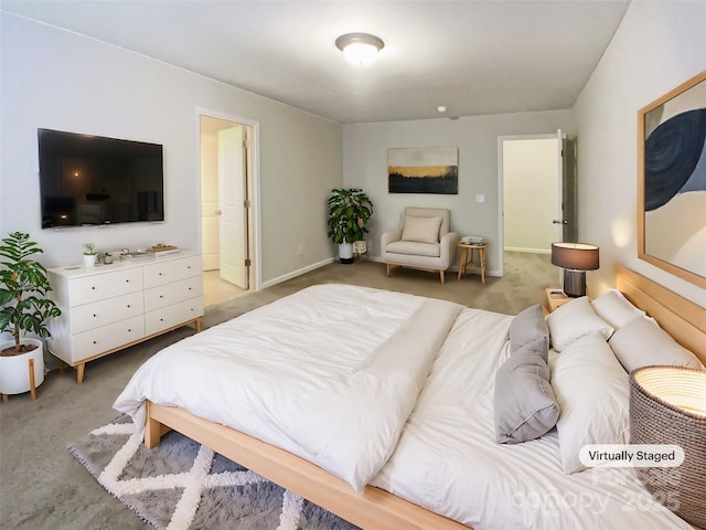 carpeted bedroom with baseboards