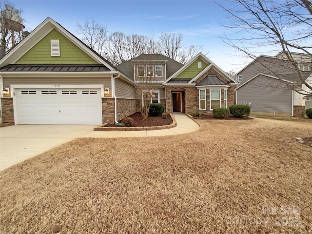 craftsman inspired home featuring driveway, a standing seam roof, and metal roof