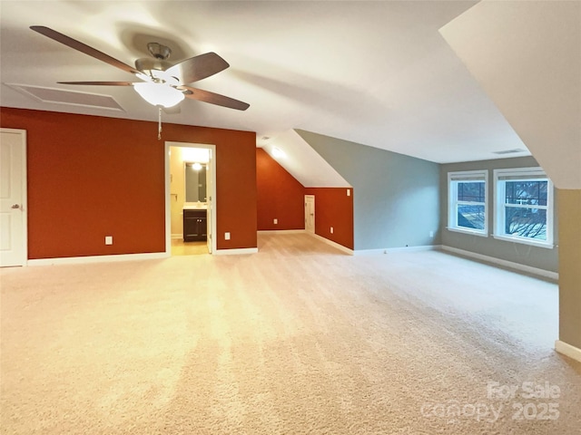 bonus room with ceiling fan, visible vents, baseboards, vaulted ceiling, and carpet