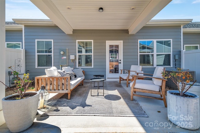 view of patio / terrace with fence and an outdoor living space