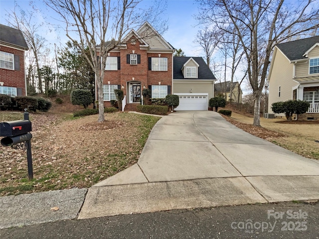 view of front of house with an attached garage, concrete driveway, and brick siding