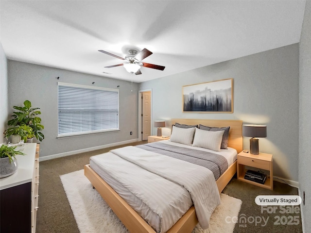 bedroom with ceiling fan, carpet, and baseboards