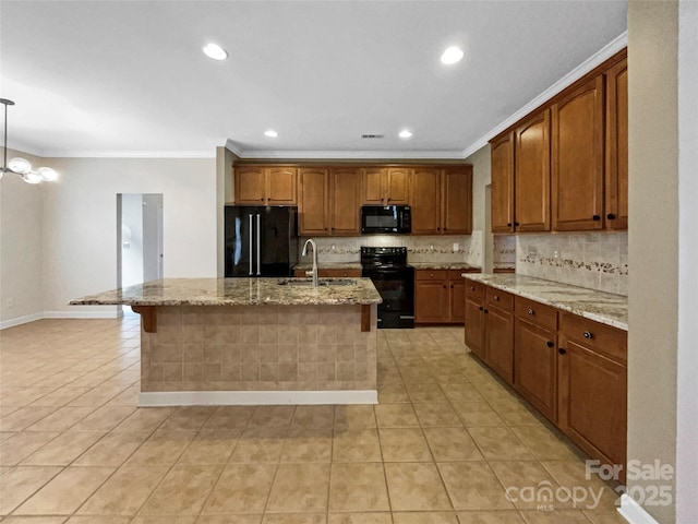 kitchen with decorative backsplash, light tile patterned flooring, a sink, and black appliances