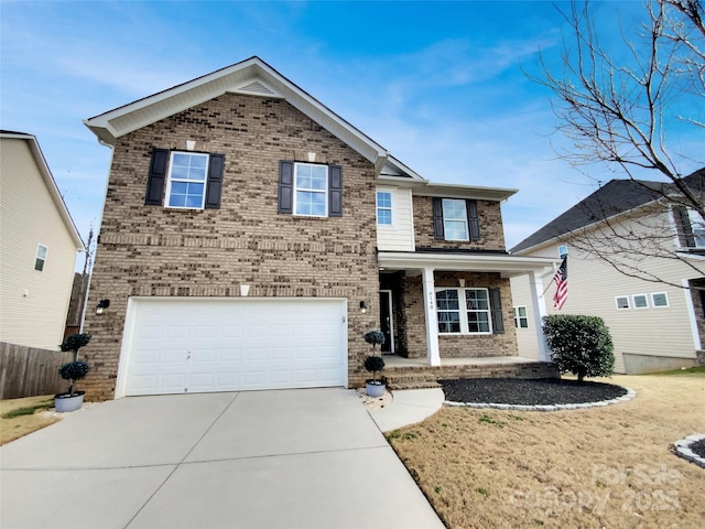 traditional-style home featuring a garage, concrete driveway, and brick siding