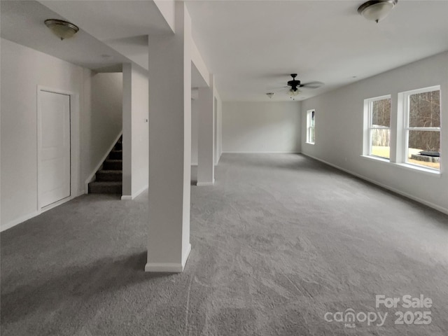 interior space with stairs, carpet flooring, and baseboards