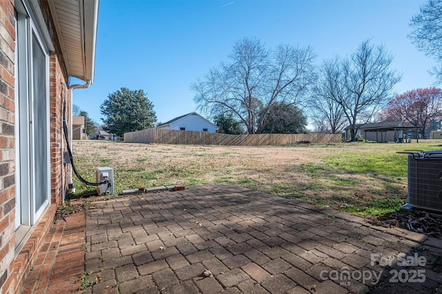 view of patio with fence and cooling unit