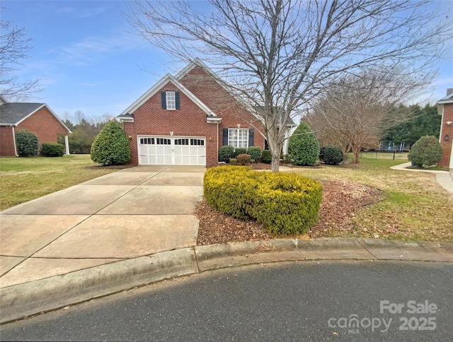 traditional-style house featuring a garage, driveway, brick siding, and a front lawn