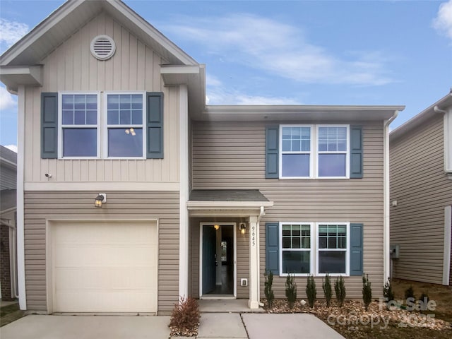 view of front of home with a garage and driveway