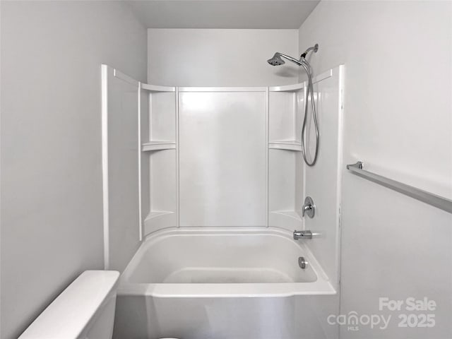 bathroom featuring toilet and shower / tub combination