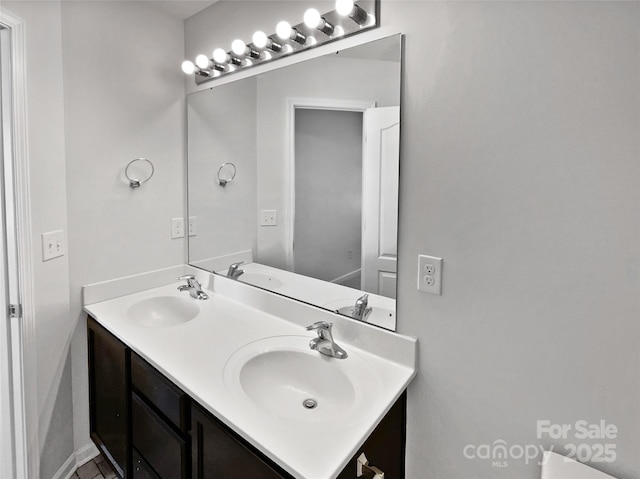 bathroom with double vanity and a sink