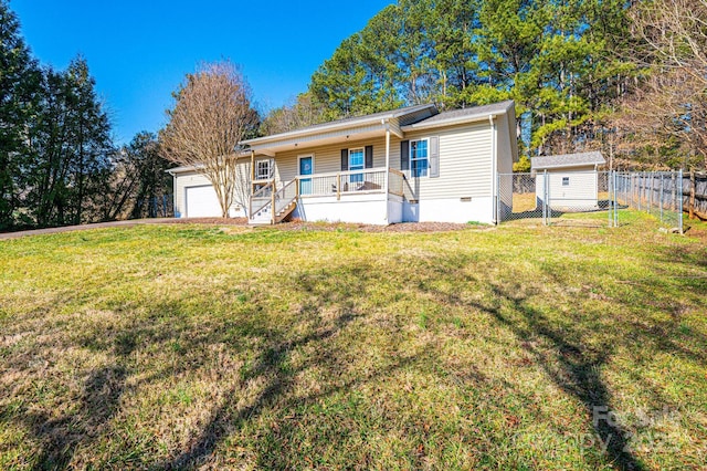 ranch-style home with covered porch, crawl space, a front yard, and fence