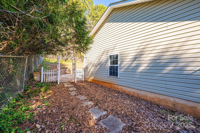 view of home's exterior featuring fence